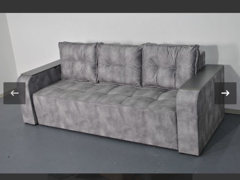 Диван Бухарест розкладний є ніша в підлокітниках та велике спальне місце